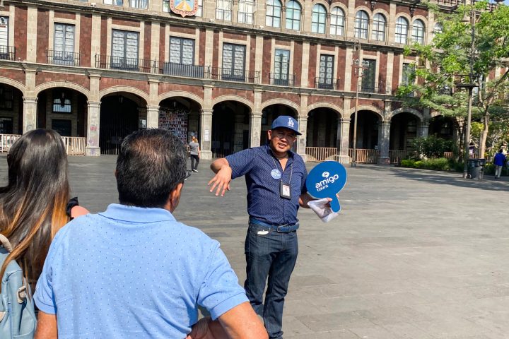 a group of people standing in front of a building