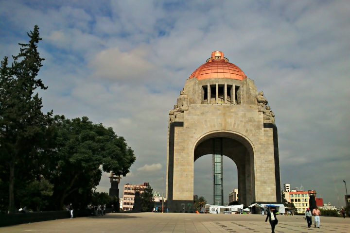 a statue in front of Hoover Tower