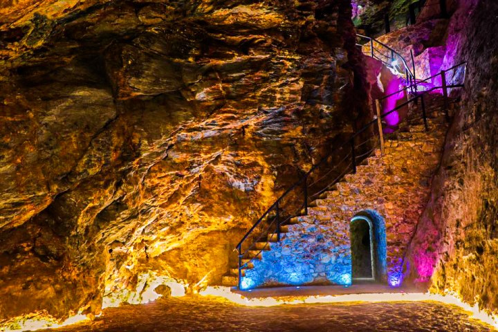 a waterfall with trees in the background