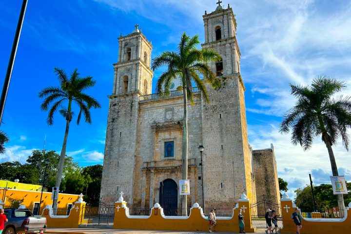 a castle with a clock tower in front of a building