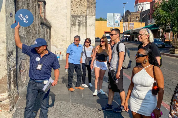 a group of people walking down a street