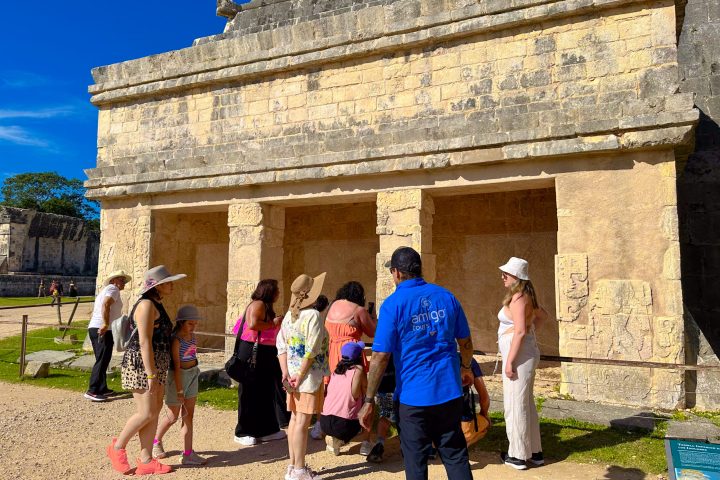 a group of people standing in front of a building
