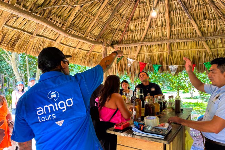 a group of people standing around a table