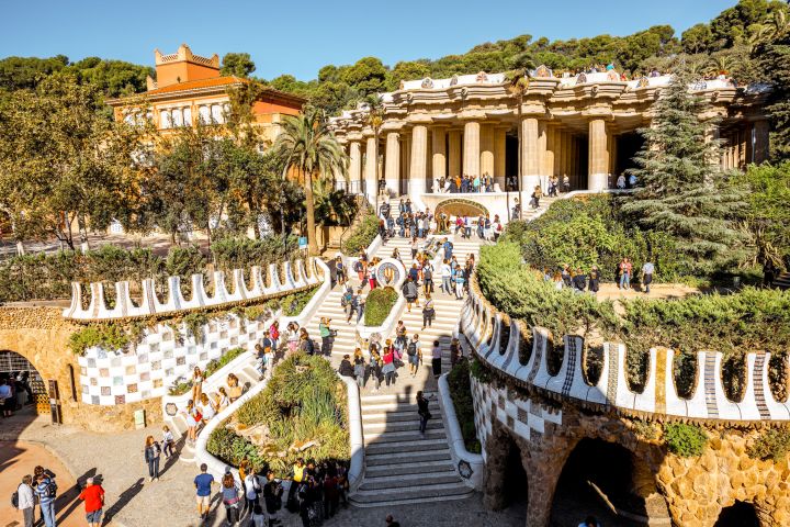 a group of people walking on Park Güell