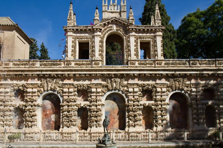 a large stone statue in front of a building