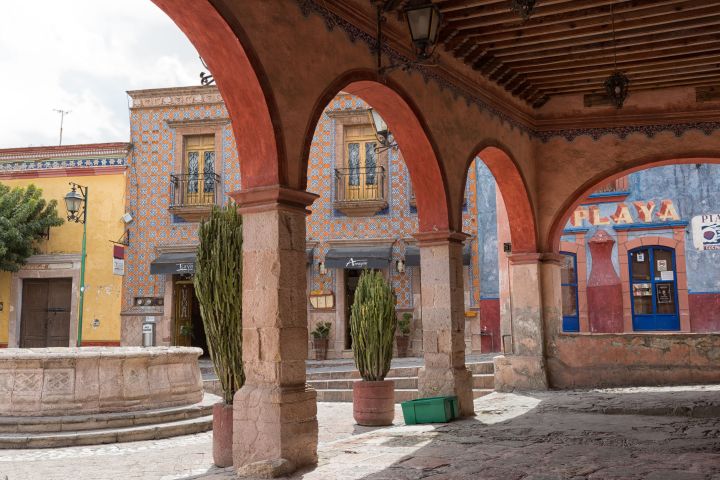 a large stone statue in front of a building