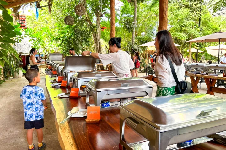 a group of people sitting at a picnic table