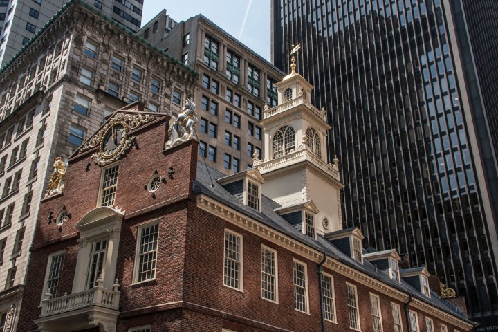 a large tall tower with a clock at the top of a building