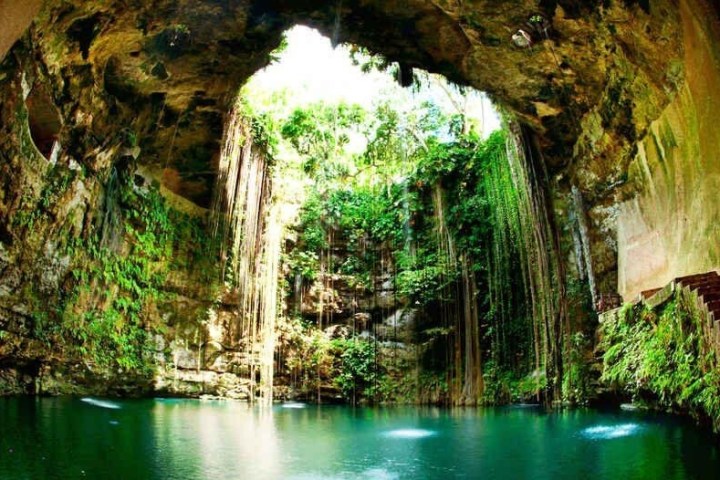 a large waterfall over a river