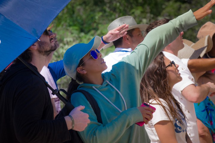 a group of people around each other