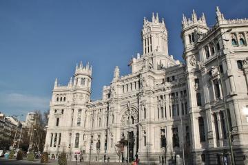a large statue in front of Plaza de Cibeles