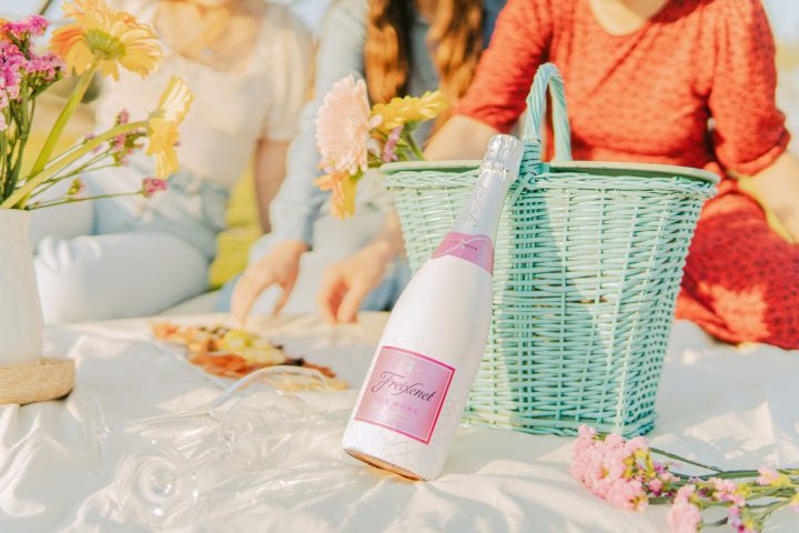 a woman sitting at a table with a cake