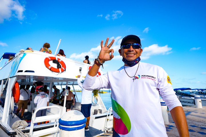 a man standing next to a car