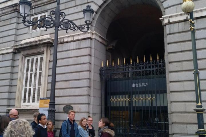 a group of people standing in front of a building