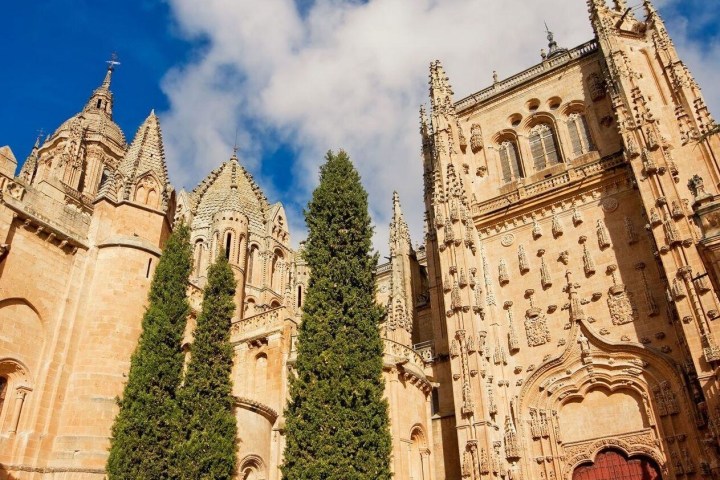 a church with a clock on the side of a building