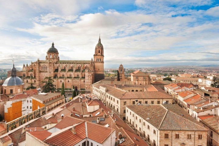 a large clock tower towering over a city