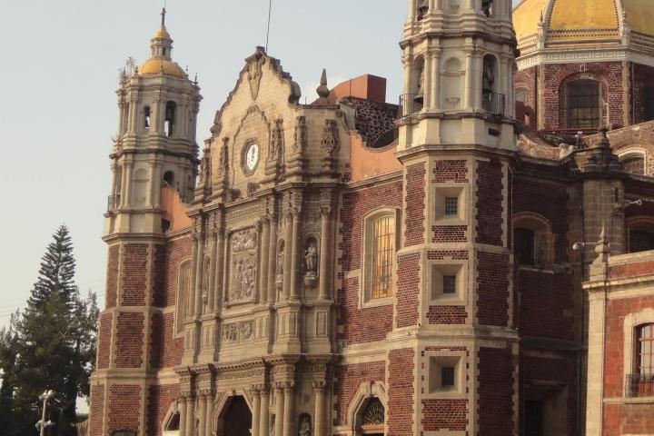 a large clock tower in front of a building