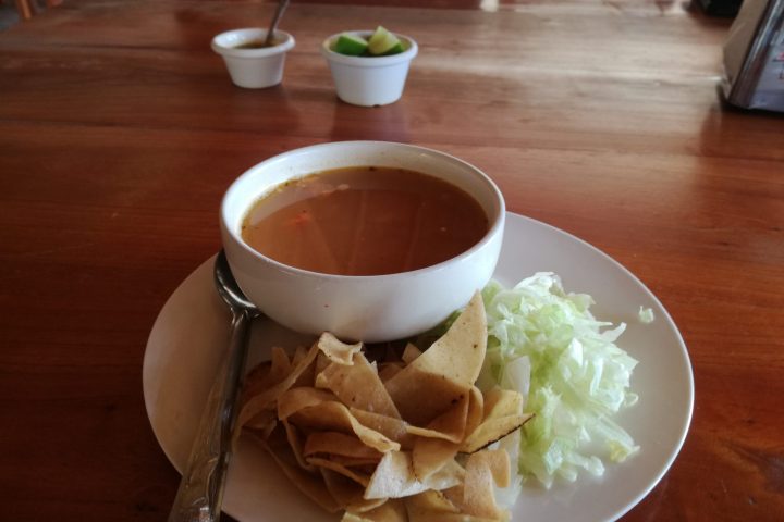 a plate of food and a cup of coffee