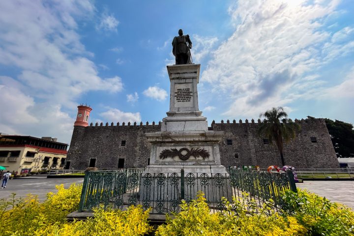 a castle with a clock at the top of a building