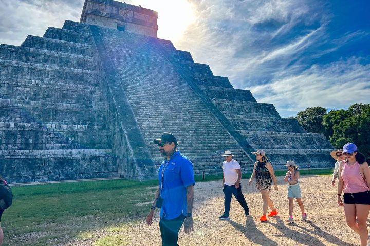 a group of people standing on top of a mountain