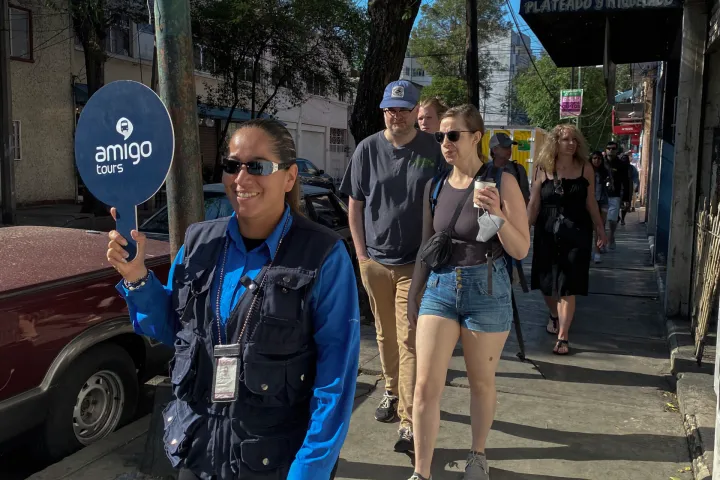 a group of people walking down the street