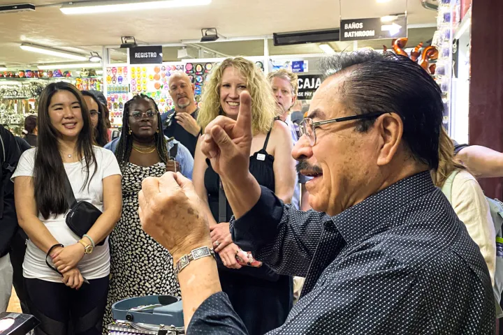 Daphne Khoo et al. standing in a room