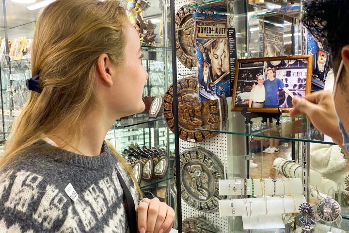 a person standing in front of a store