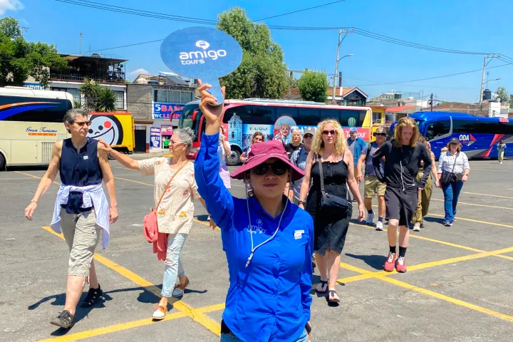 a group of people standing in a parking lot