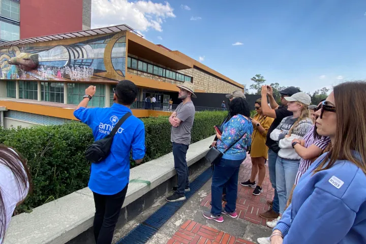 a group of people standing in front of a building