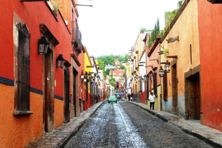 a building with a store on the sidewalk