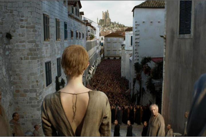 a group of people standing in front of a building