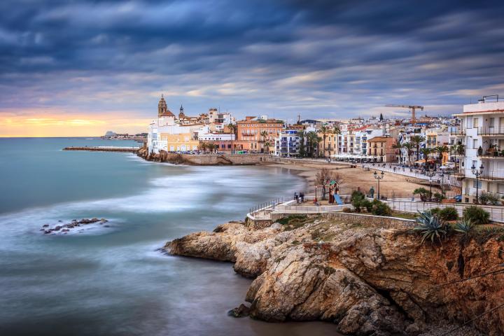 a large body of water with a city in the background