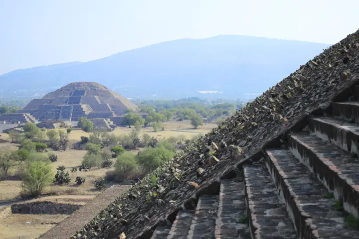 a bridge with a mountain in the background