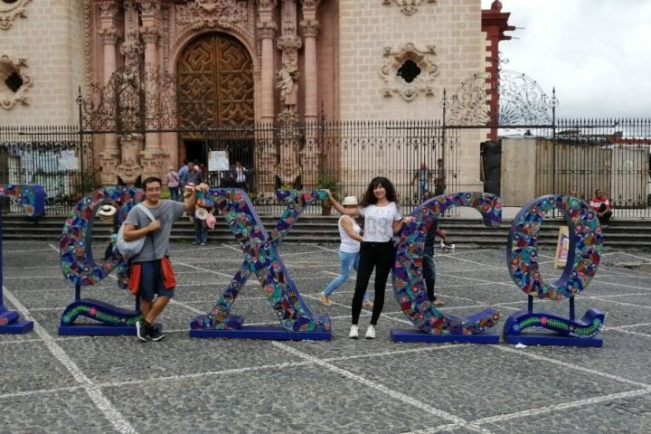 a group of people standing in front of a building