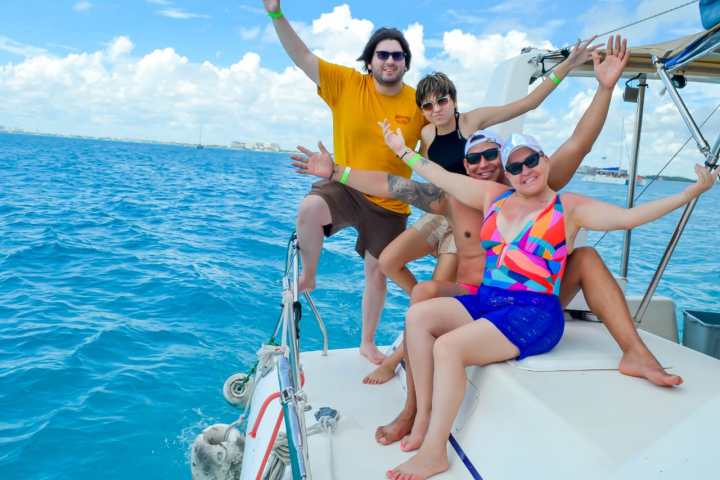 a person holding a baby in a body of water