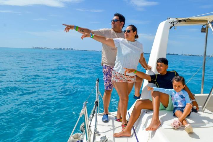 a man and a woman standing next to a body of water