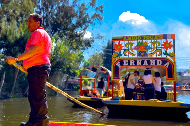 a group of people on a boat in the water