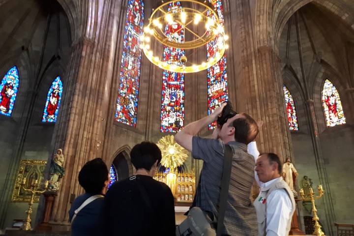 a group of people standing in front of a building