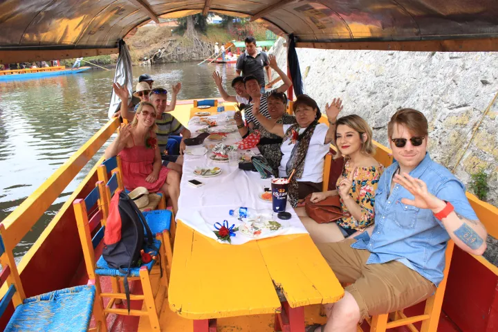 a group of people sitting on a boat