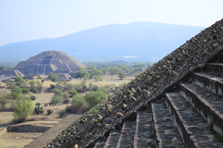 a bridge with a mountain in the background