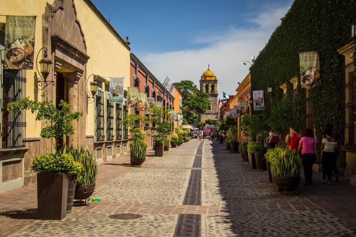 a group of people walking in front of a building