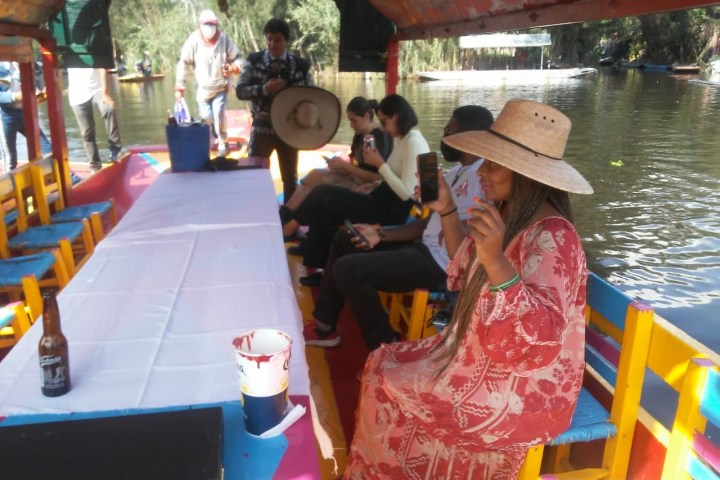 a group of people on a boat in the water