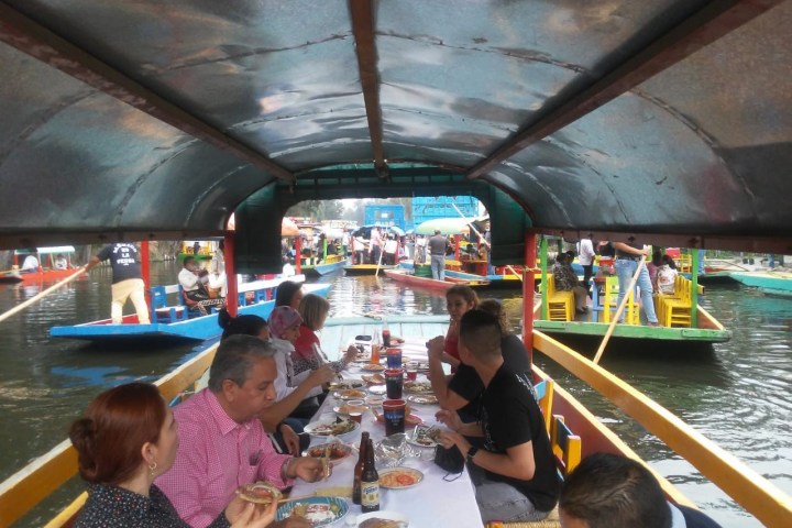 a group of people on a boat in the water