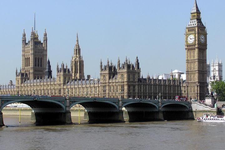 a large bridge over water with a city in the background