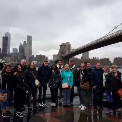 a group of people standing on a bridge