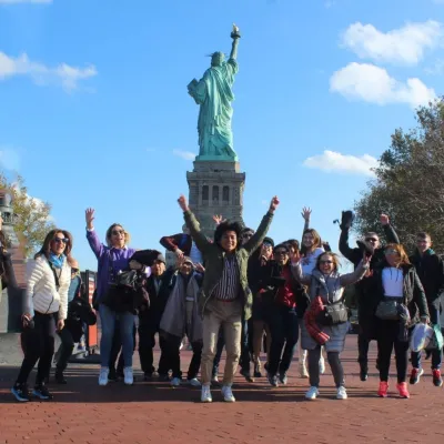 a group of people standing in front of a crowd posing for the camera