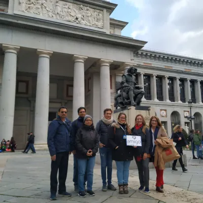 a group of people standing in front of a building