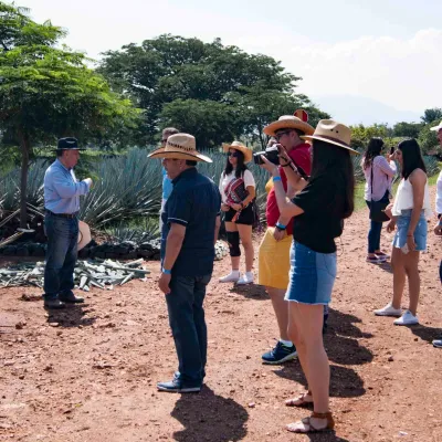 a group of people that are standing in the dirt