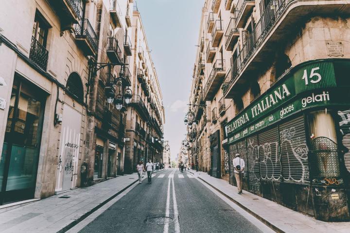 a street scene with focus on the side of a building