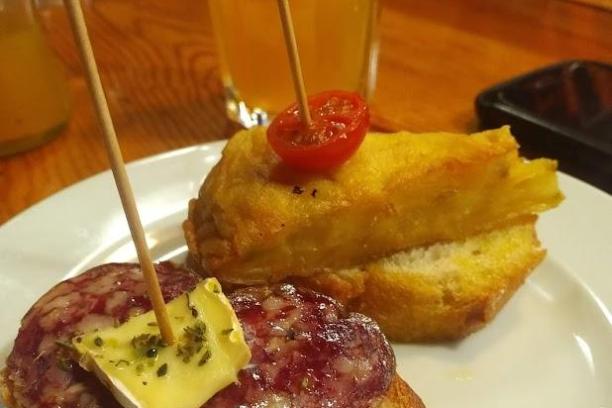 a plate of food and a glass of orange juice